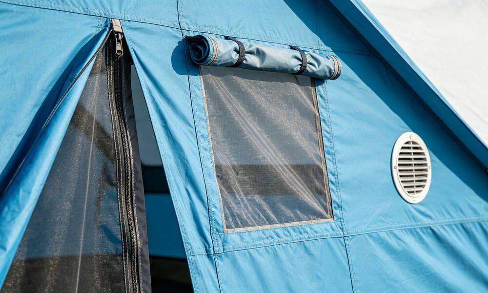 Emergency tent entrance door with zipper, roll-up window with mosquito netting and ventilation vent Emergency tent entrance door with zipper, roll-up window with mosquito netting and ventilation vent