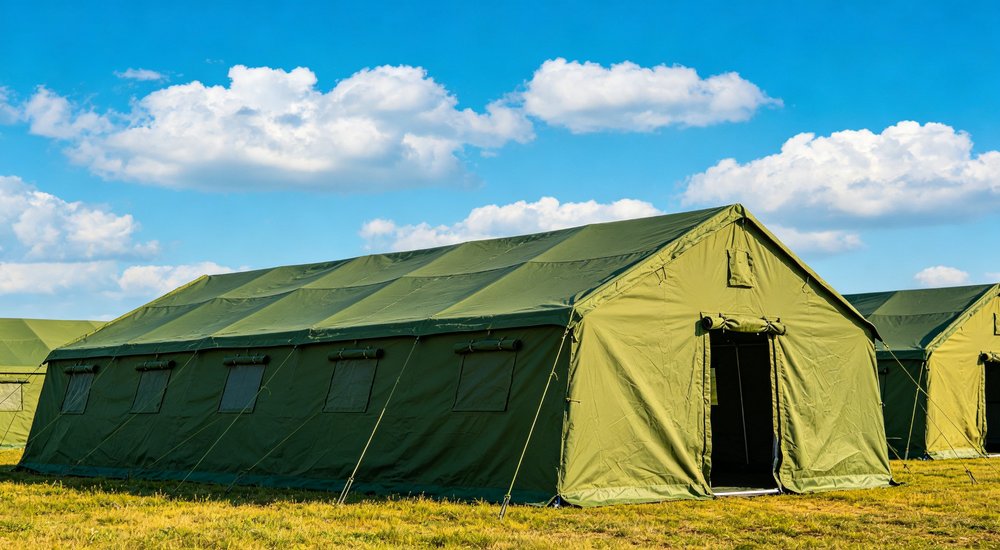 Humanitarian relief tent photographed at aid distribution camp providing reliable shelter with strong steel framework quality stitching and weather resistant fabric for disaster affected communities