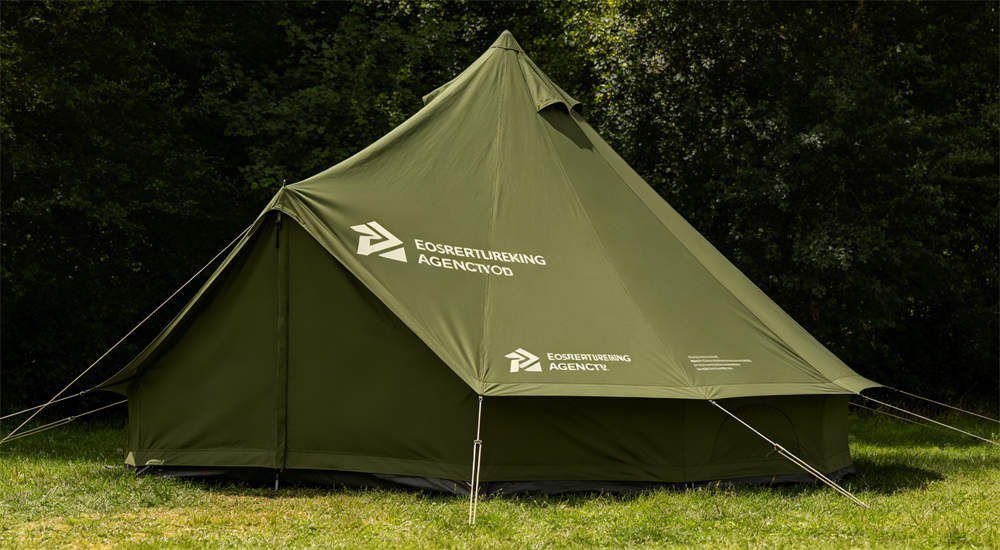 Steel frame tents stored in dry warehouse, folded canvas covers and stacked metal poles, long term storage and inventory management for relief agencies