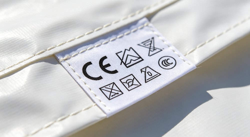 Certification label on inflatable isolation tent showing EN 1822 HEPA rating, close-up detail red and white inflatable emergency shelter for disaster relief operations