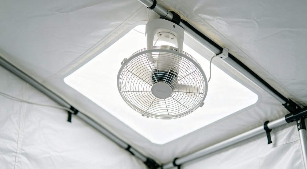 Portable ventilation fan for inflatable medical tent, fan with ducting, product shot red and white inflatable emergency shelter for disaster relief operations